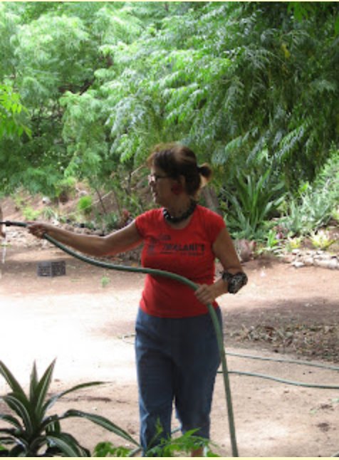 Iwalani tending to the healing garden